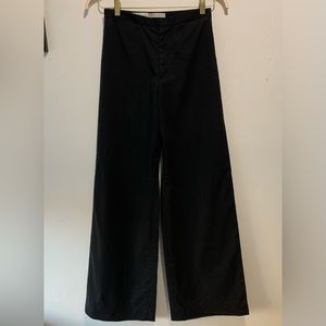 TSE's black high-waisted wide-leg pants.